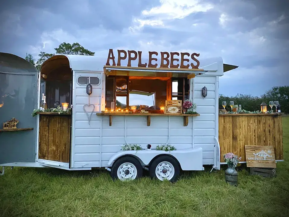 Cost to Hire a Food Truck: Food Truck Hire Prices, Rental, and More

This image shows a horse trailer converted into a mobile bar, with the text "APPLEBEES" written on the side.

Food truck hire costs vary depending on a number of factors, including the type of food truck, the location of the event, the time of year, and the duration of the event. However, you can expect to pay anywhere from £400 to £600 for the basic hire fee.

In addition to the hire fee, you will also need to pay for the food and drinks that your guests consume. This cost will vary depending on the food truck's menu and the number of guests you have.

If you are considering hiring a food truck for your next event, be sure to get quotes from multiple trucks before making a decision. You should also ask about any additional fees, such as travel costs and setup fees.